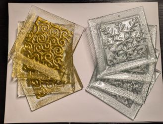 2 sets of Decorative Gold and Silver Square Glass Coasters with textured, embossed center