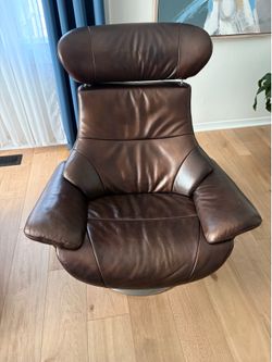 Kuka karma Dania Leather accent Swivel Lounge Chair