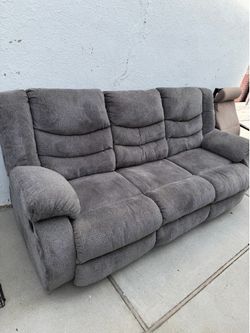 Reclining sofa in perfect physical condition.