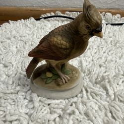 Vintage porcelain female cardinal figurine In very good condition
