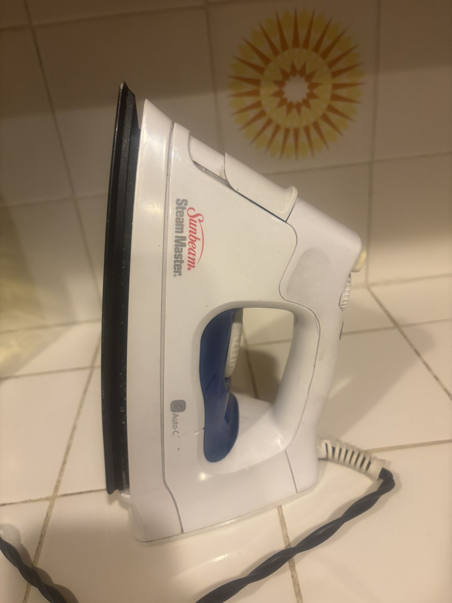 Sunbeam Steam Master iron, commonly used for removing wrinkles from clothes