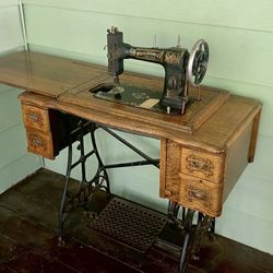 Antique White Sewing Machine In A Tiger Oak Cabinet