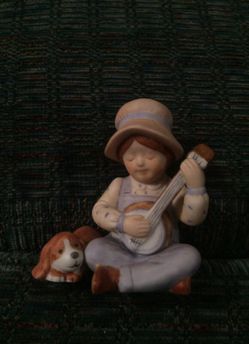 Boy with dog playing banjo