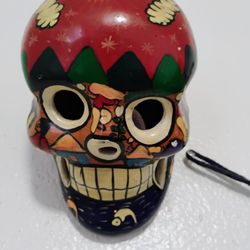 Terra Cotta Sugar Skull With Mural On It 