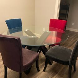 Clear Glass Dining table with colorful chairs (4)