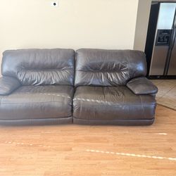Brown Leather Reclining Sofa – $250