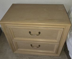 light-colored wooden nightstand is from the Stanley Furniture Washed Oak coastal contemporary collection. 