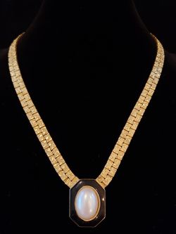 $10. Vintage gold tone nugget black enamel and faux pearl necklace. 17 inches long. Pendant is 1 inch long and 3/4 inch long.