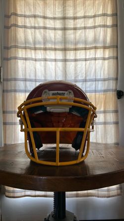 Schutt red and yellow youth football helmet