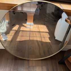 24 inch mirror with gold trip