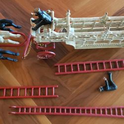Vintage 1960's cast iron fire hook and ladder wagon made by Utexiqual in the United States. T