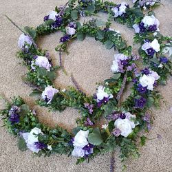 2 Artificial Flower Garland wreaths for table decor

Condition is used twice
$110 for longest wreath
$100 for shorter

Measurement of each arrangement