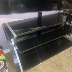 TV stand 60 to an 80 inch TV will fit on it