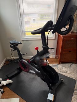 Peloton bike, mat and shoes