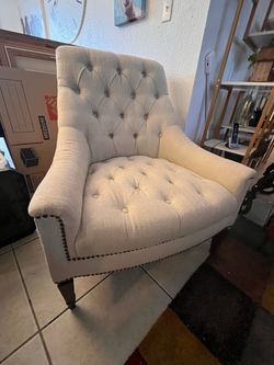 Tufted cream chair