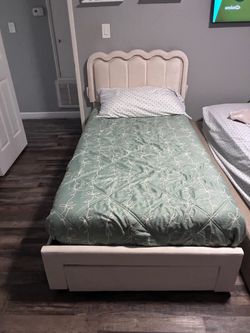 Twin bed along with mattress