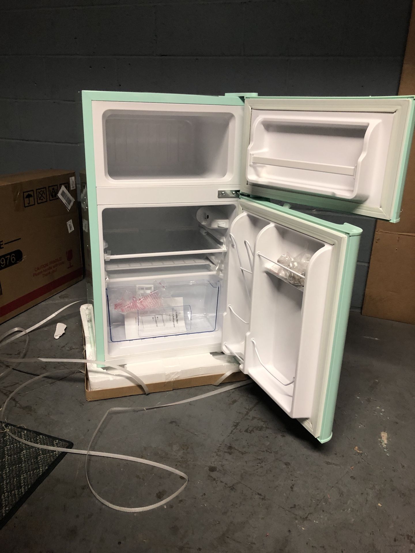 Compact Mini Refrigerator with Separate Freezer in the box with small dent on one side