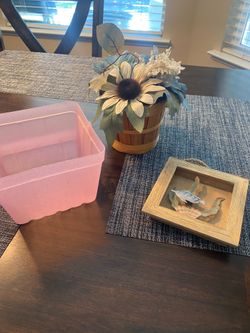 Pink basket planter with flowers small fish wall decor