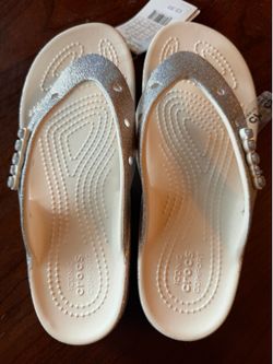 New women’s size 6 Crocs sandals