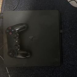 PS4 Slim 1TB (with controller and cables).
