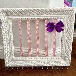 Adorable Girls Hair Bow And Jewelry Accessory Holder   Has hooks on the bottom for necklaces or jewelry or hair ties.  Hangs on the wall.  In good con