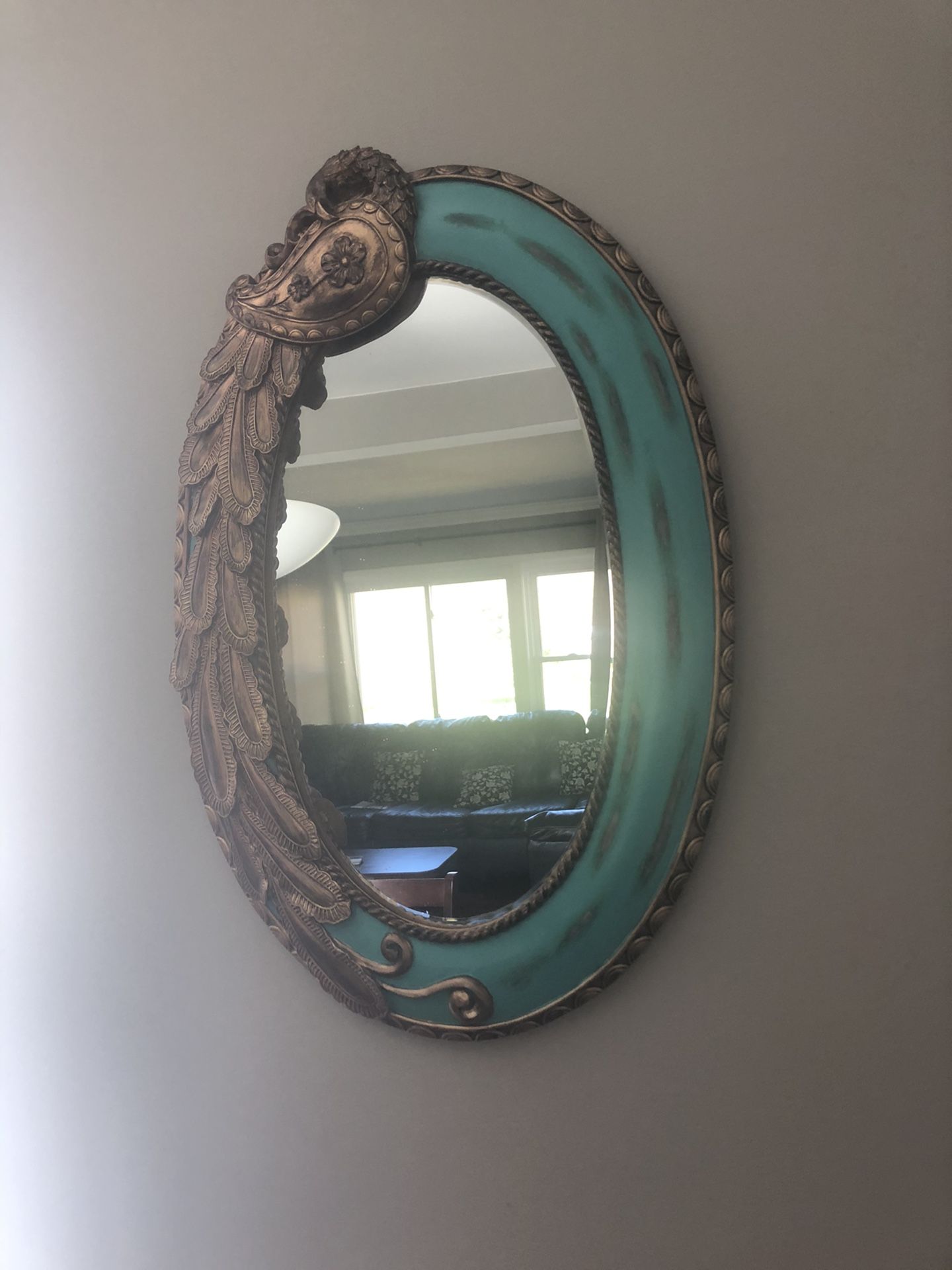 Oval peacock mirror