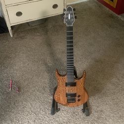 Selling an electric guitar I pick up today name on top looks like DeRaud ?