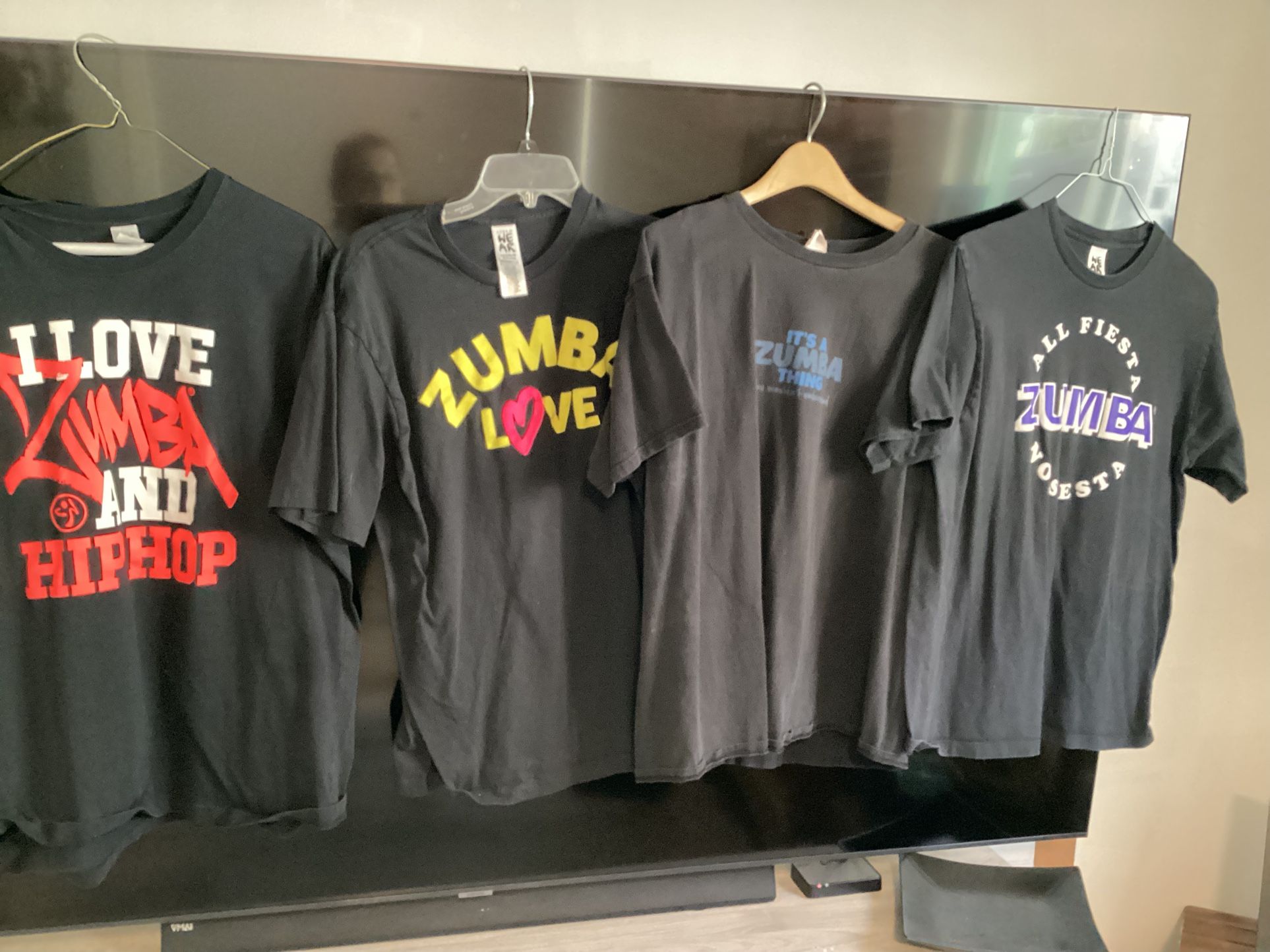 Four Zumba XL Shirts