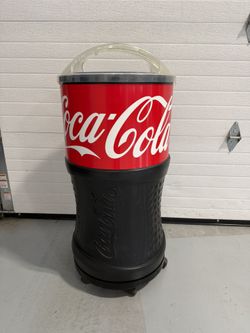 Coca Cola rolling display cooler in good working condition measuring about 40” tall 