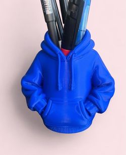 This hoodie organizer for pens and pencils is made on a 3D printer. Colors: black, blue, gray, yellow, red.