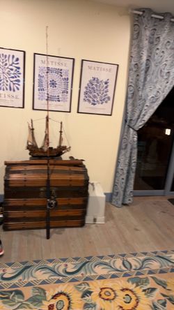 This antique dome-top steamer trunk features distinctive curved wooden slats and reinforced metal hardware steamer wood trunk