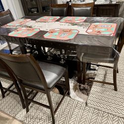 A leather dining room set with very good quality wood,