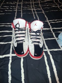 Red black and white Jordan's size 11