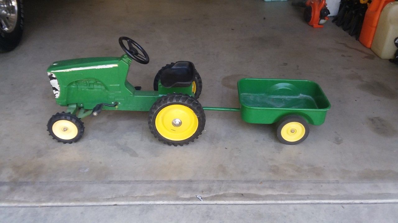 John Deere pedal tractor and trailer.