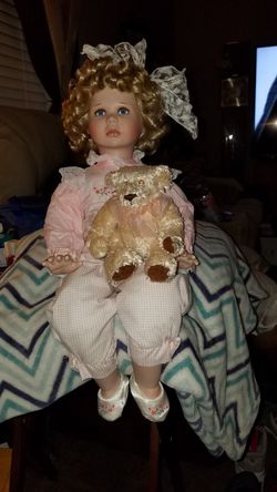 Porcelain little girl with teddy bear