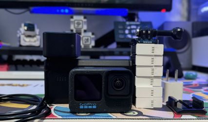 Go Pro Hero Black 12 With A Bunch Of Batteries And Accessories