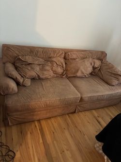 Brown sofa and loveseat