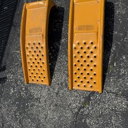 SET OF TWO HEAVY DUTY METAL CAR RAMPS IN GOOD CONDITION. $40.00  OR BEST OFFER.