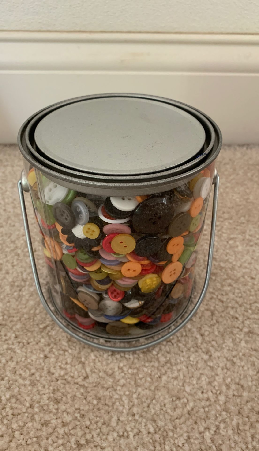 Pail full of buttons. Brand new