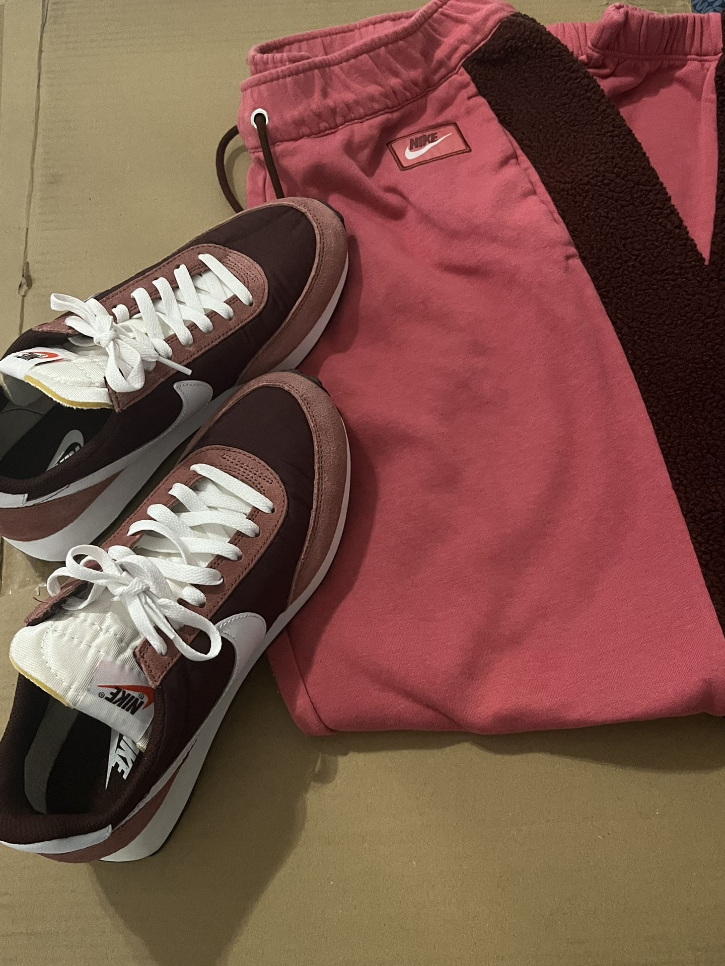 Woman’s sweatpants (L) and Nike Shoes (9)