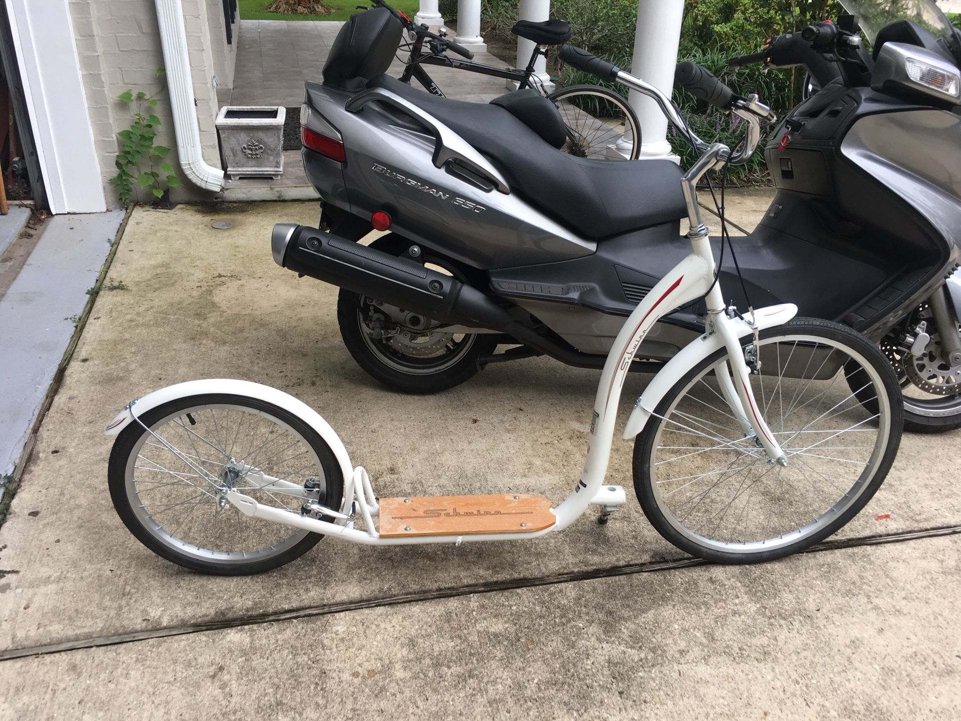 Brand new Schwinn Adult Kick Bike with extra front wheel.