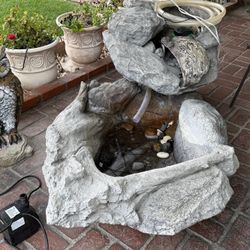 Beautiful pond fountain with submersible pump, LED lights and waterfall