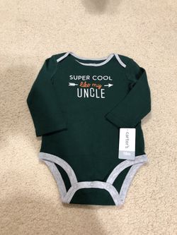 BRAND NEW: Carter’s onesie in size 18 Months