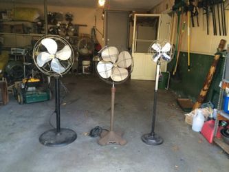 Three outstanding antique pedestal fans