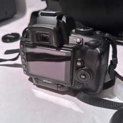 Nikon D5000 with 18-55mm lens charger battery 8gb card and case. Tested works!
