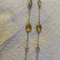 Yellow crystal , thin chain,gold tone necklace. 18 inches. Costume jewelry.