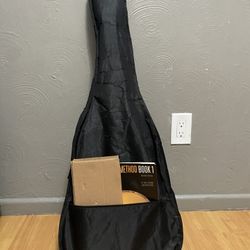 Classical guitar with book and stool