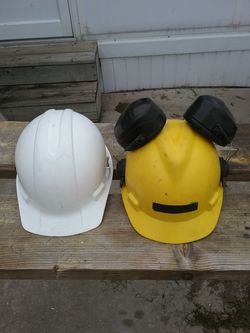 2 hard hats, 1 with ear protection