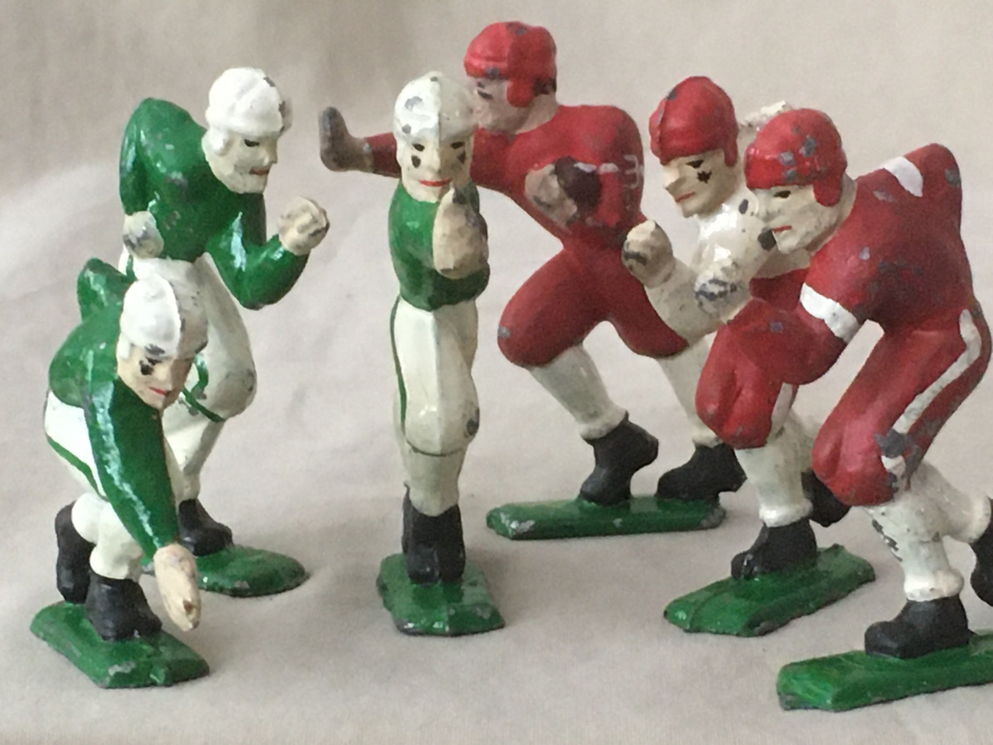6 Antique Cast Iron Football Players