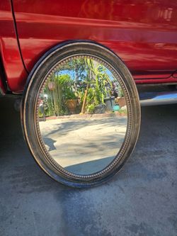 Nice Bronze and gold Oval Mirror